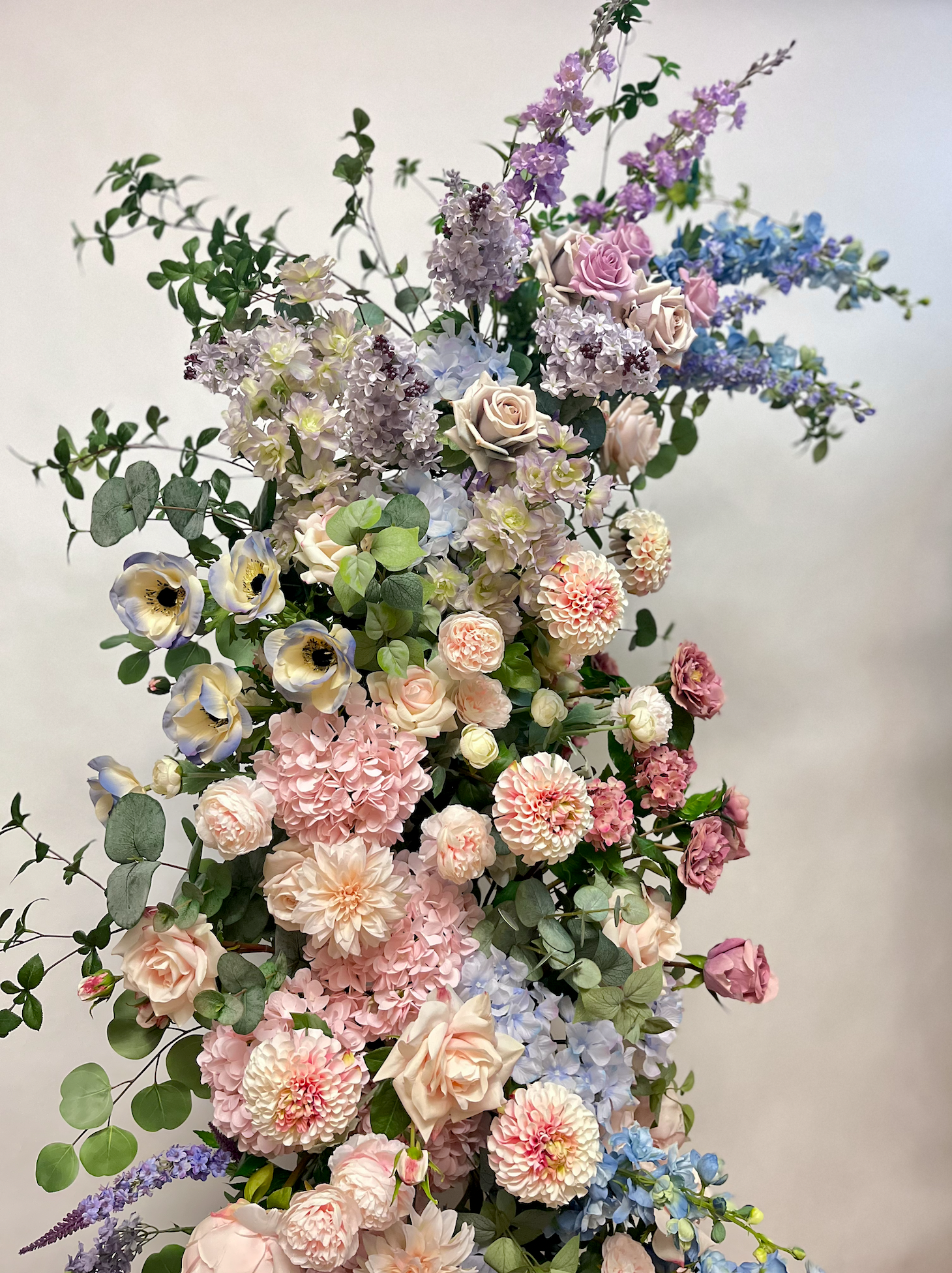 Watercolor floral arch for mixed pastel wedding